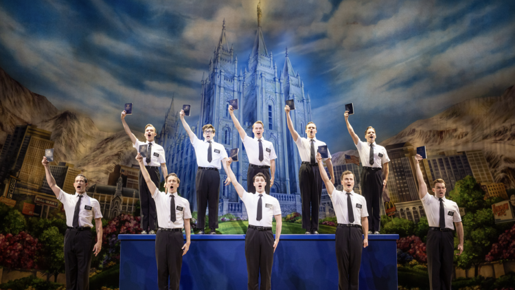 Actors with their hands in the air