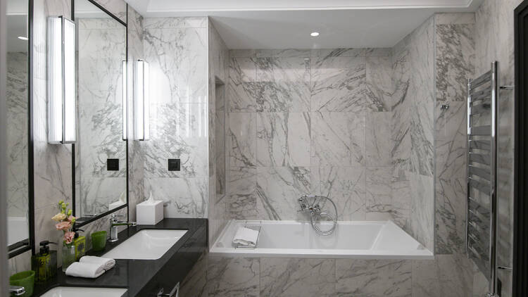 Bathroom at Maison Ablar with marble walls and sink
