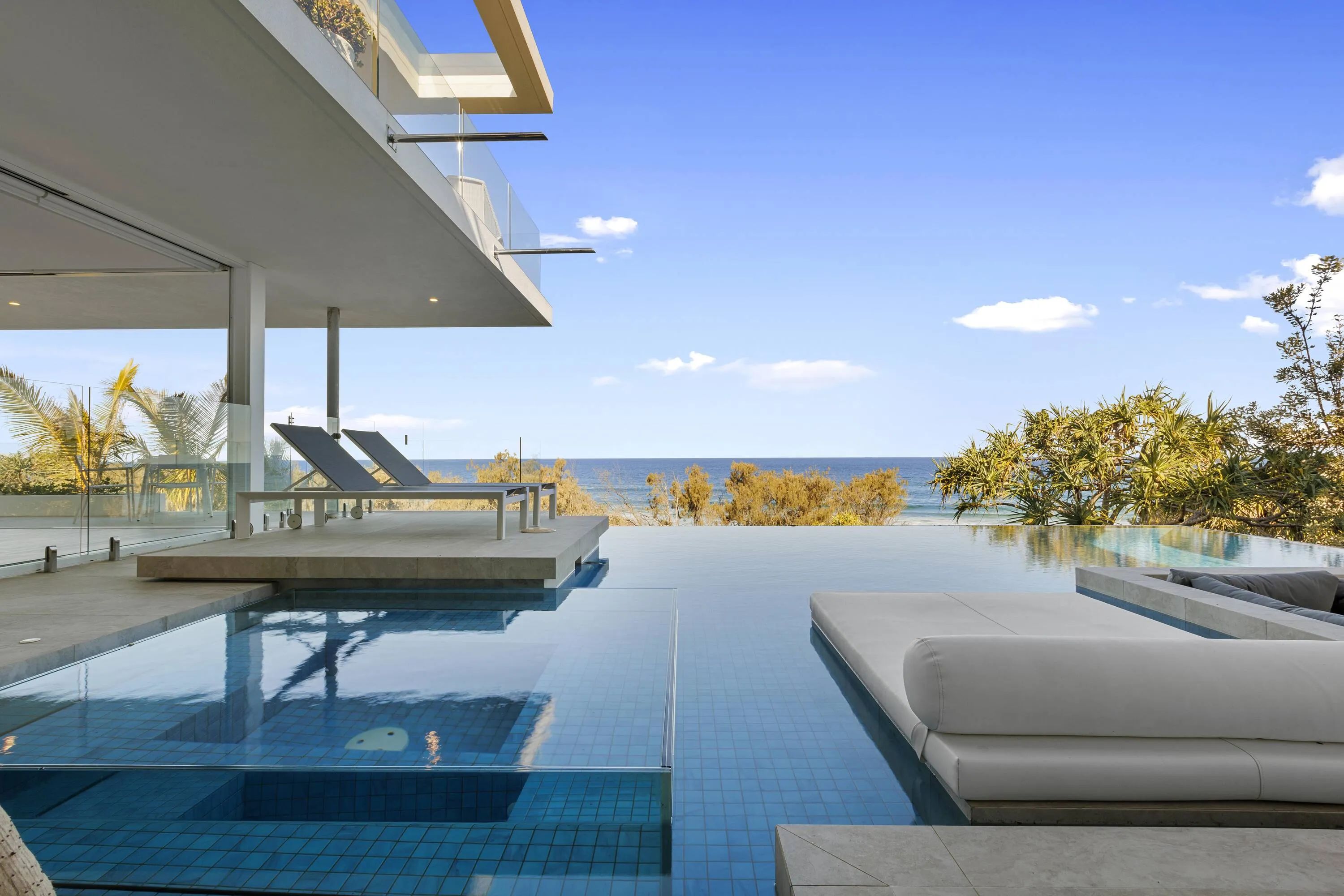 Holiday home pool overlooking beach