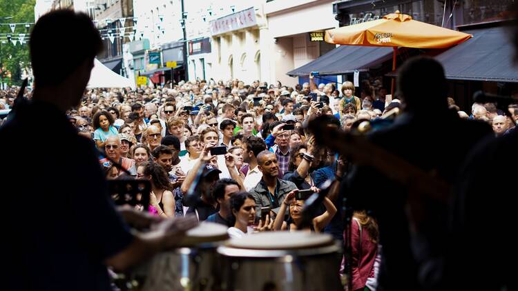 Crowds gather in front of the stage at Ronnie Scott’s Street Party