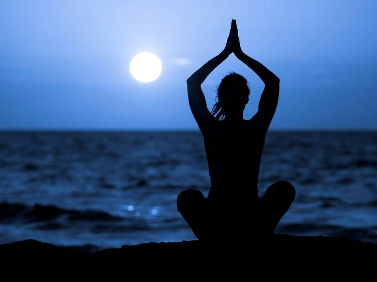 Practise yoga on a full moon night