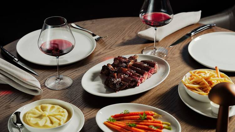 Spread of plates and red wine