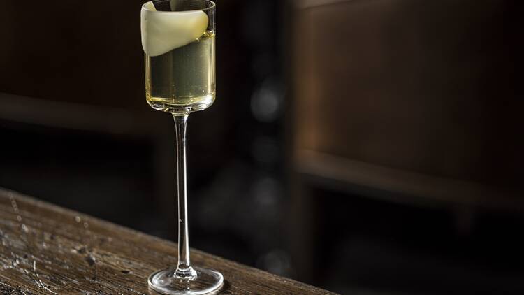 A cocktail in a long stemmed glass 