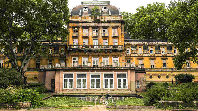 1800-squaremetre park with trees, many of wich are centuries old and the facade of the historical Lukacs Termal Bath building with the medicinal bath section and the indoor swimming pool in Budapest.