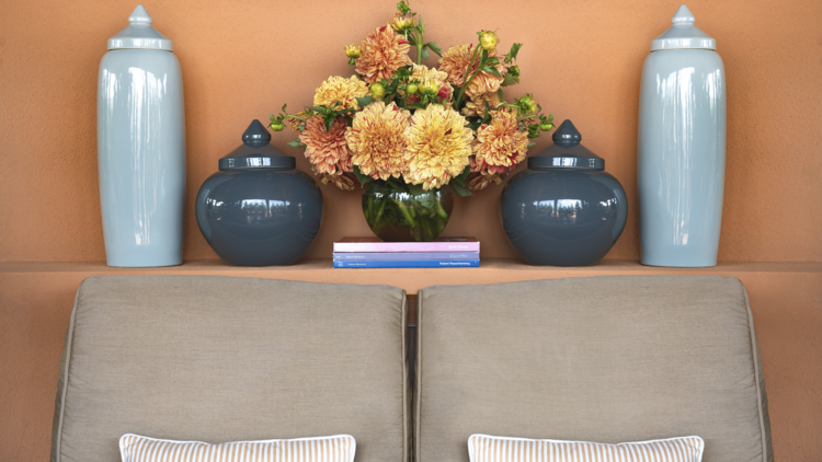 Orange room at Portrait Roma, with flowers and pots