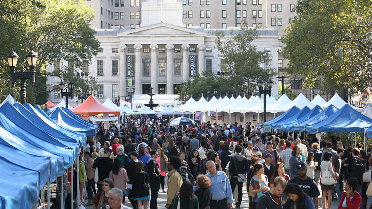 Many tents line a street for a book marketplace.