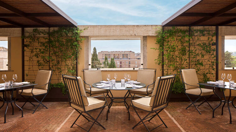Bulgari Roma outdoor dining area with views of Rome in the background