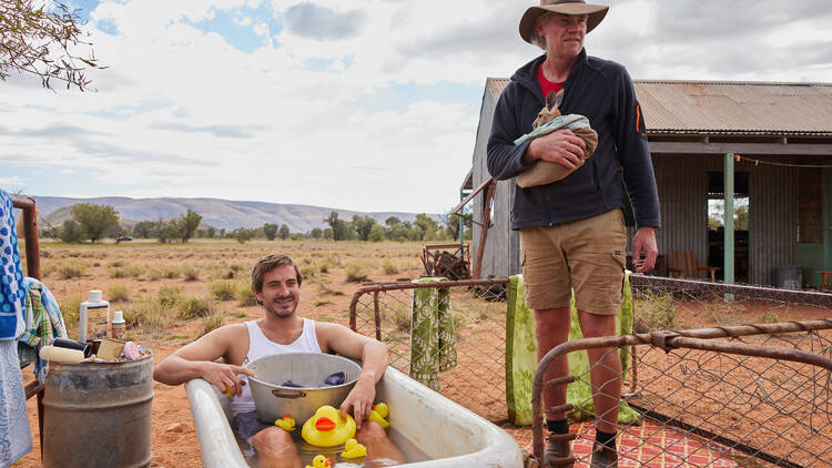 Man in bathtub in outback