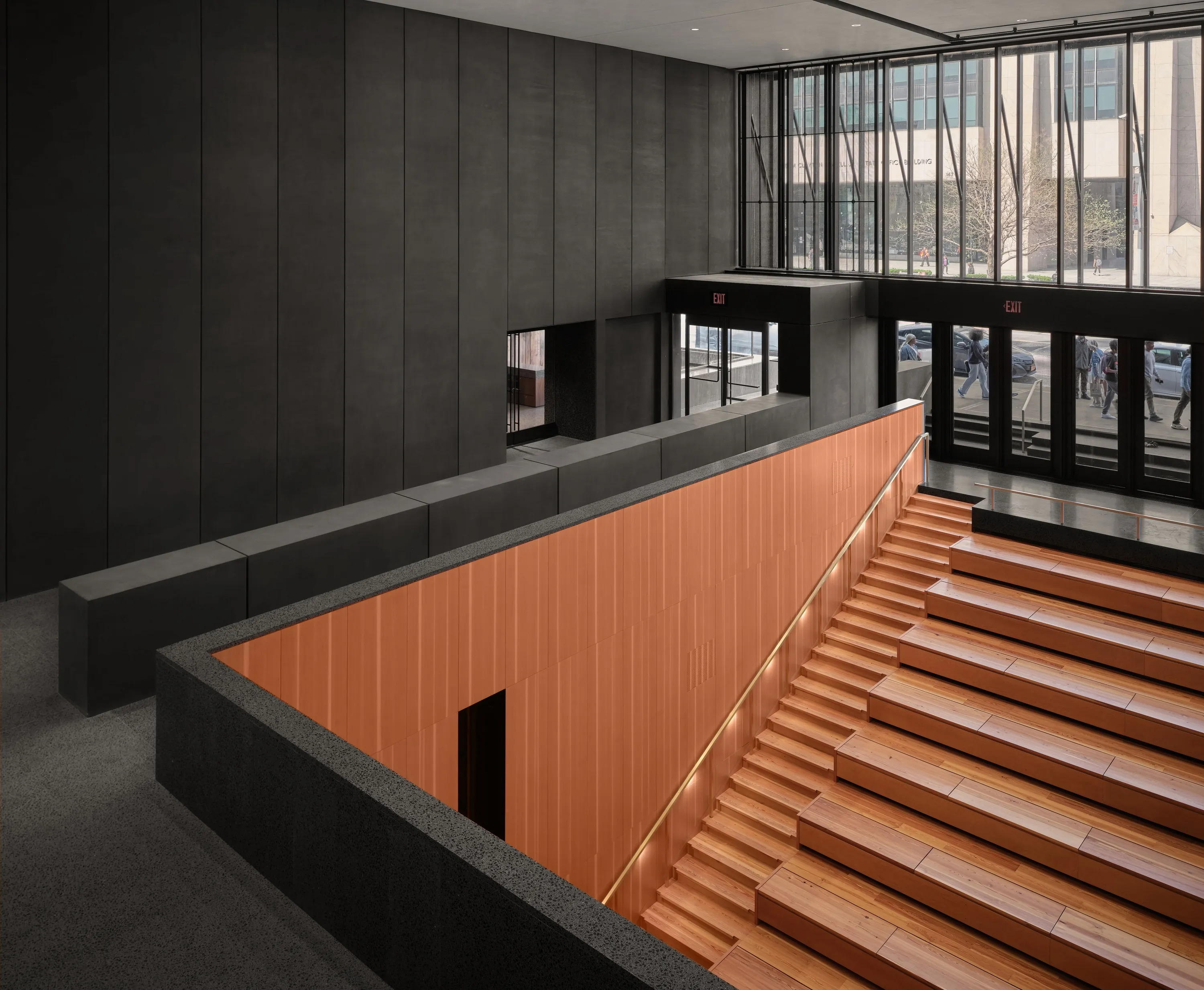 A wooden staircase and stoop inside a museum.