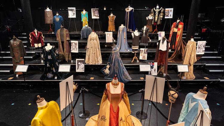 Shakespearean Costumes from The Public Theater on display with descriptions of what each is
