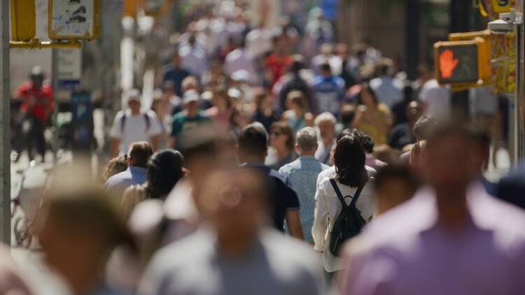 New Yorkers walking down city street