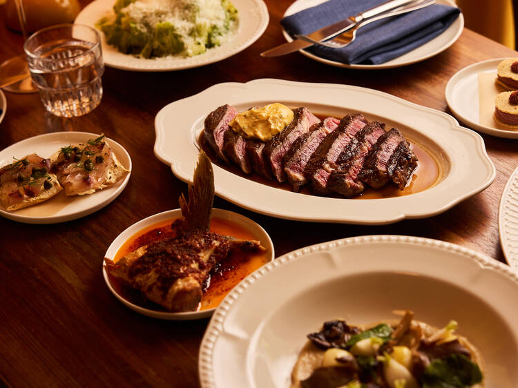 Steak with other dishes on table