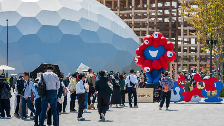 Visitors queue for a photo with Myaku-Myaku