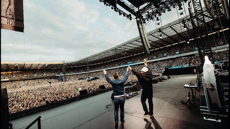 Oasis performing live at Murrayfield stadium in Edinburgh