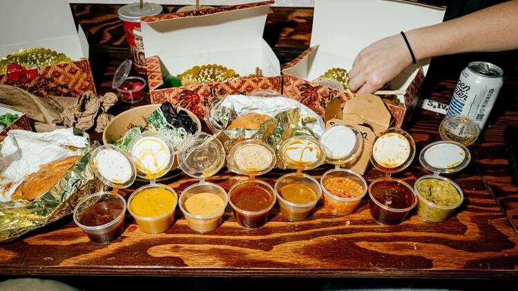 Three boxes of chicken tenders and sauces