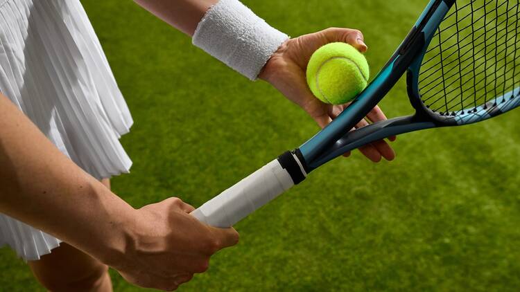 A tennis player wearing a sweat band 