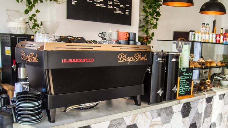 Counter of DropShot Coffee Wimbledon showing La Marzocco  coffee machine