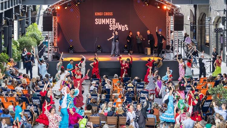 An aerial view of crowd sat in front of the stage at King’s Cross Summer Sounds
