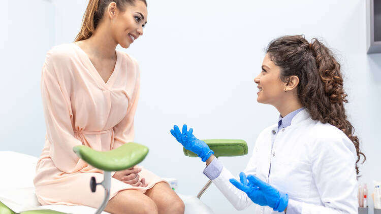 Gynecologist talking to patient