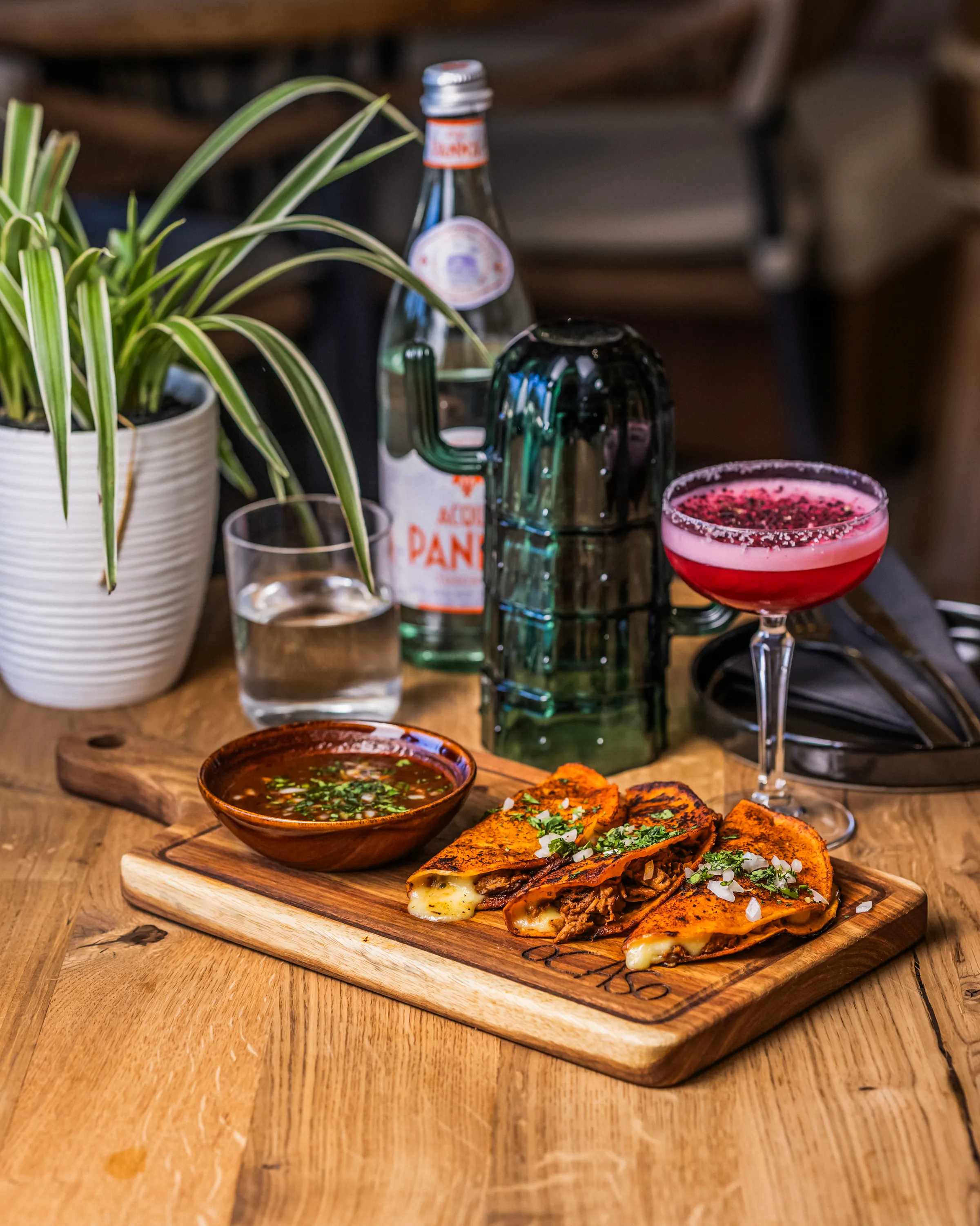 Ocaso's gorgeous beef birria tacos and Flor Del Sol cocktail.