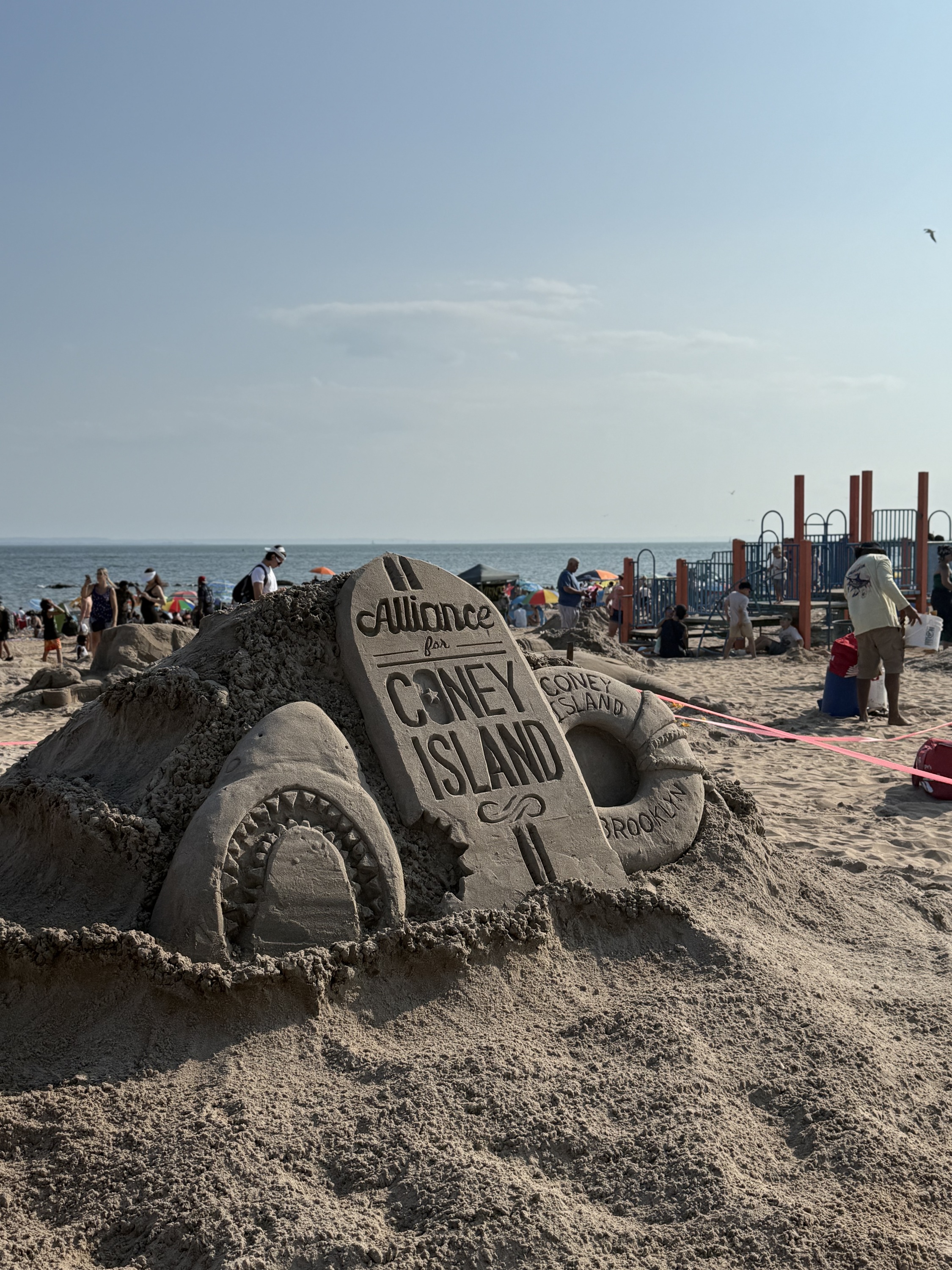 Signs announcing a sand sculpture competition.