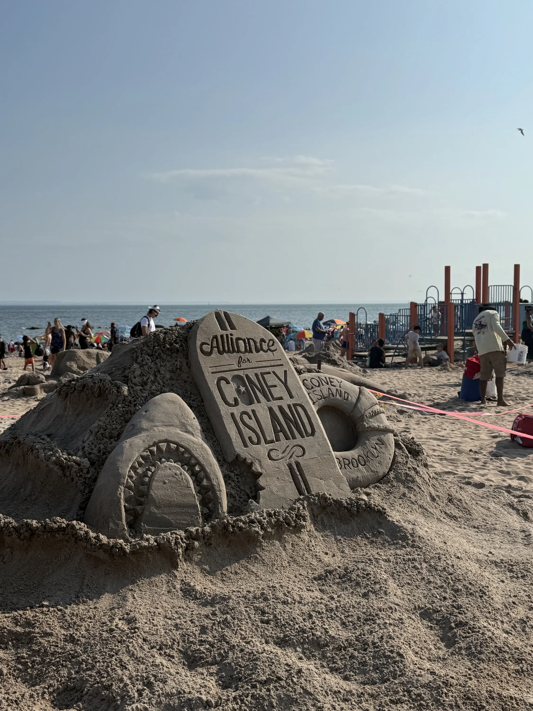 Signs announcing a sand sculpture competition.
