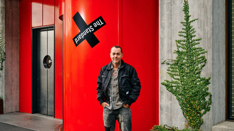 Shannon Bennett posing for the camera in front of The StandardX Melbournel.