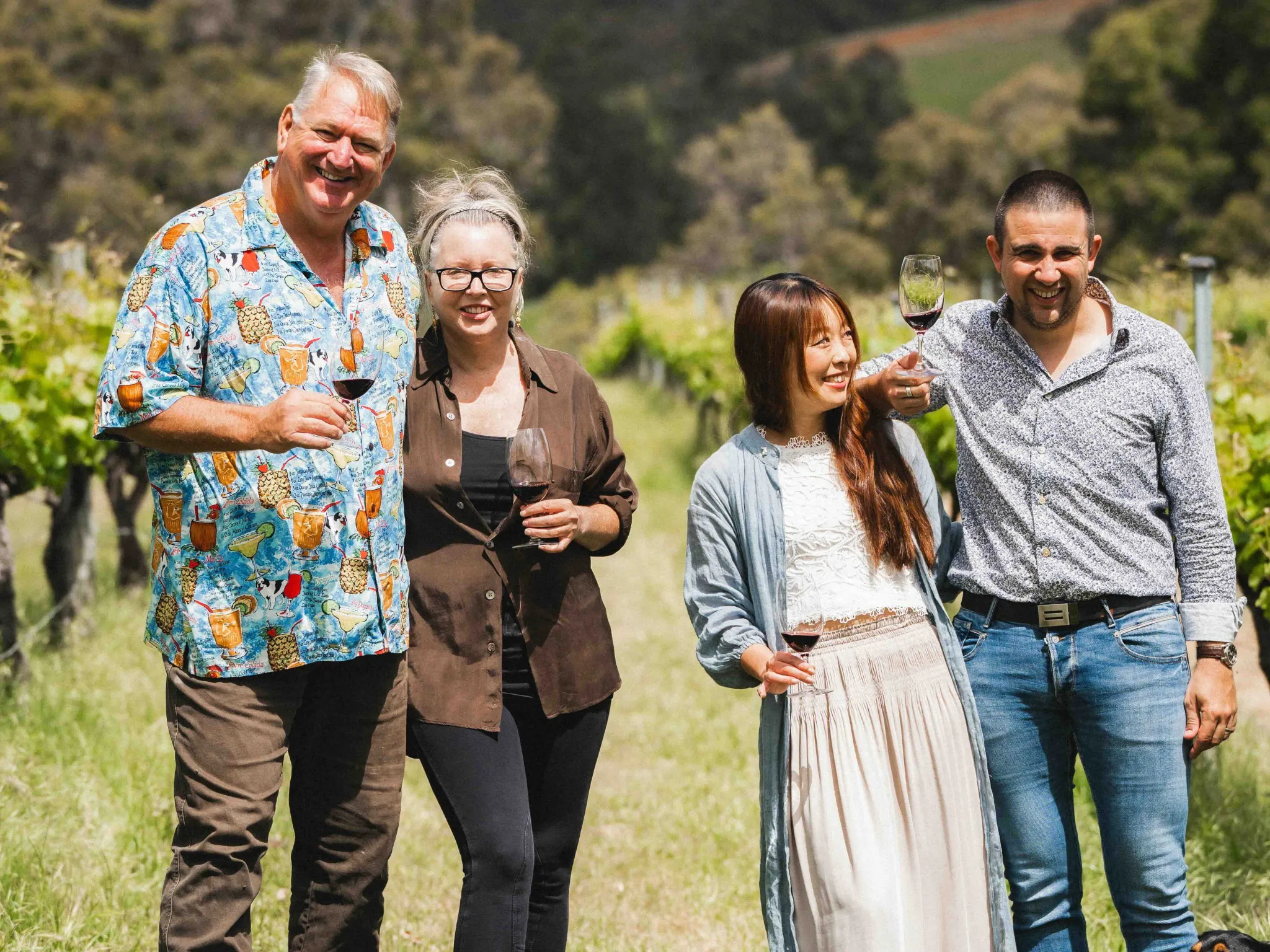 Two couples with wine
