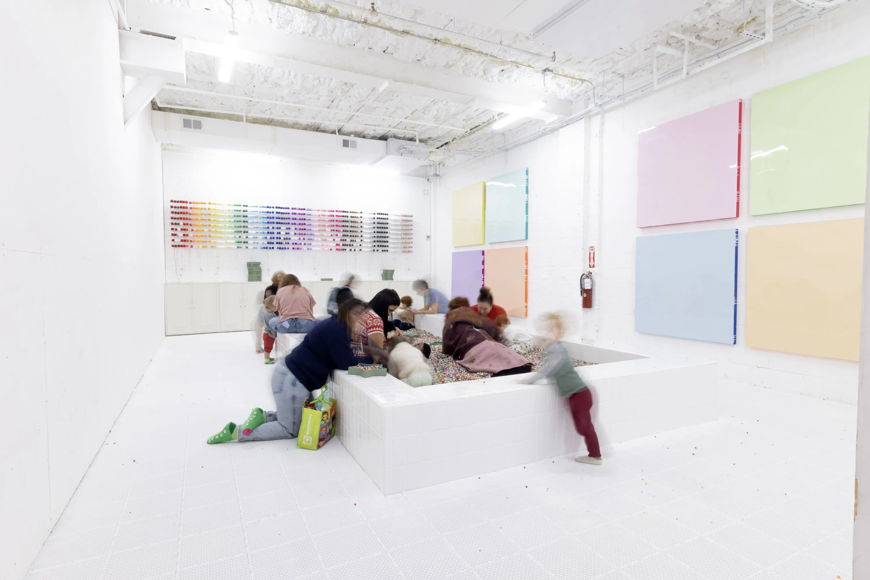 Kids play in a colorful space.