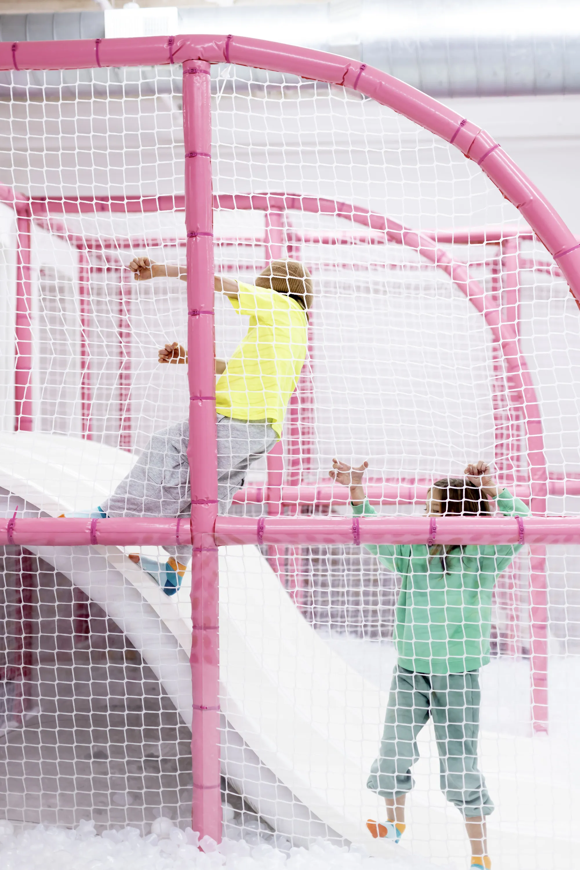 Kids play in a colorful space.