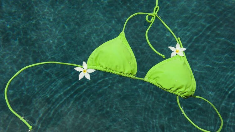 Bikini top floating in pool