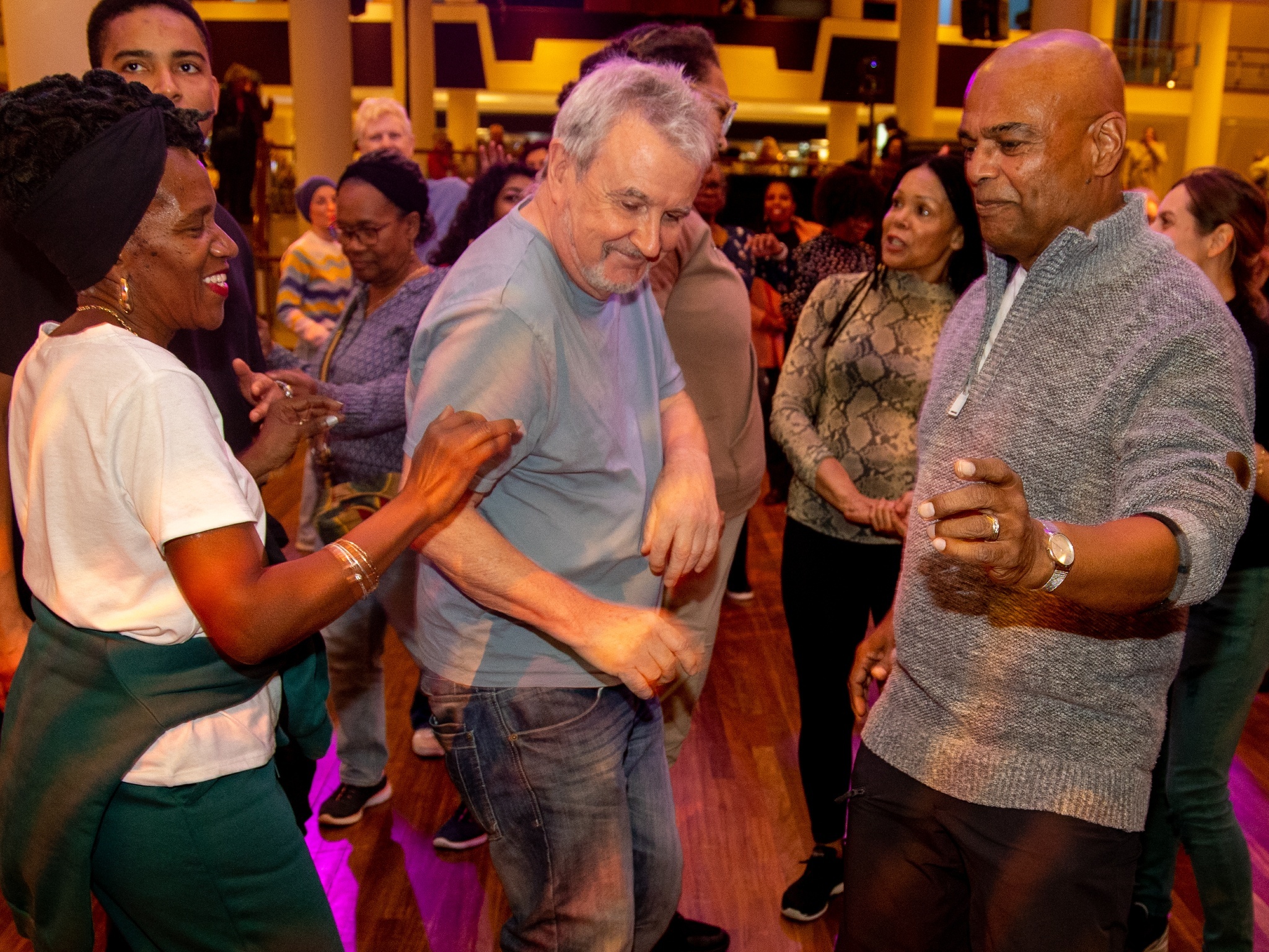 Three seniors dancing at a Mix and Move event at the Southbank Centre