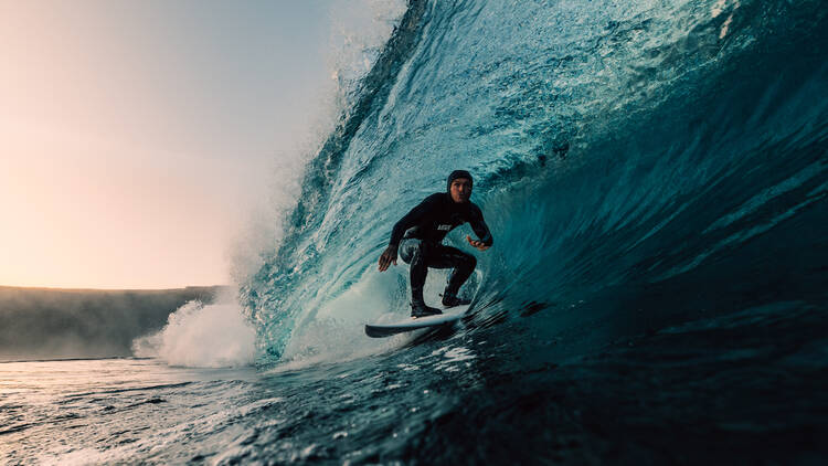 Surfer riding in a barrel, still from the film ‘Let Me Live’