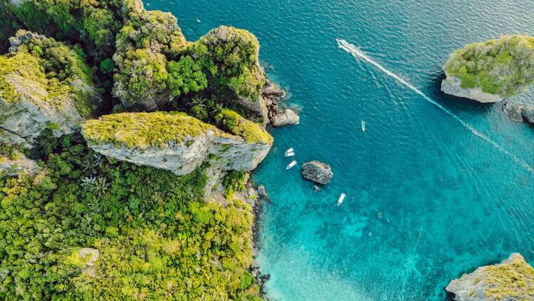 Aerial view of green island surrounded by water
