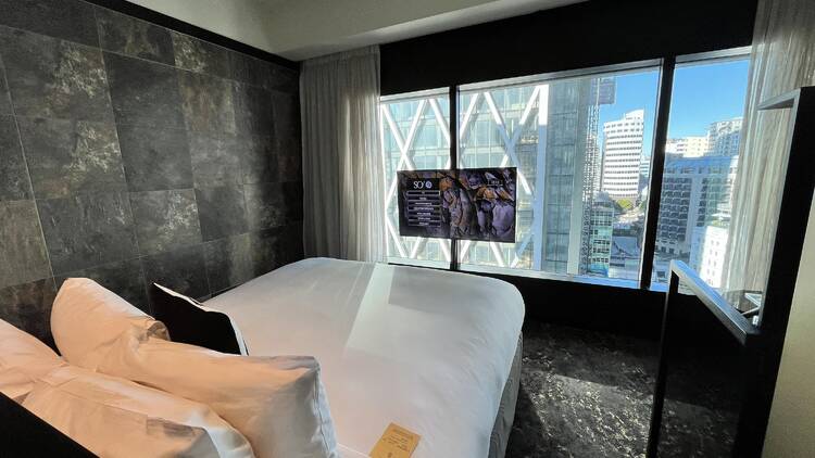 Hotel bedroom looking out to city