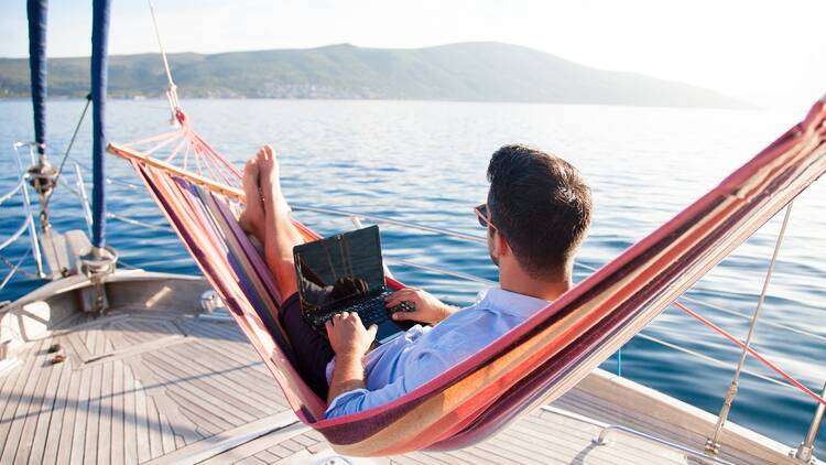 Digital nomad working on a boat