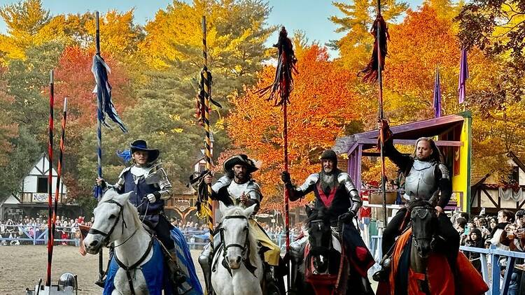 four people on horseback in knight costumes four people on horseback in knight costumes