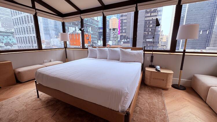Aura Hotel Times Square's penthouse bedroom is surrounded by windows