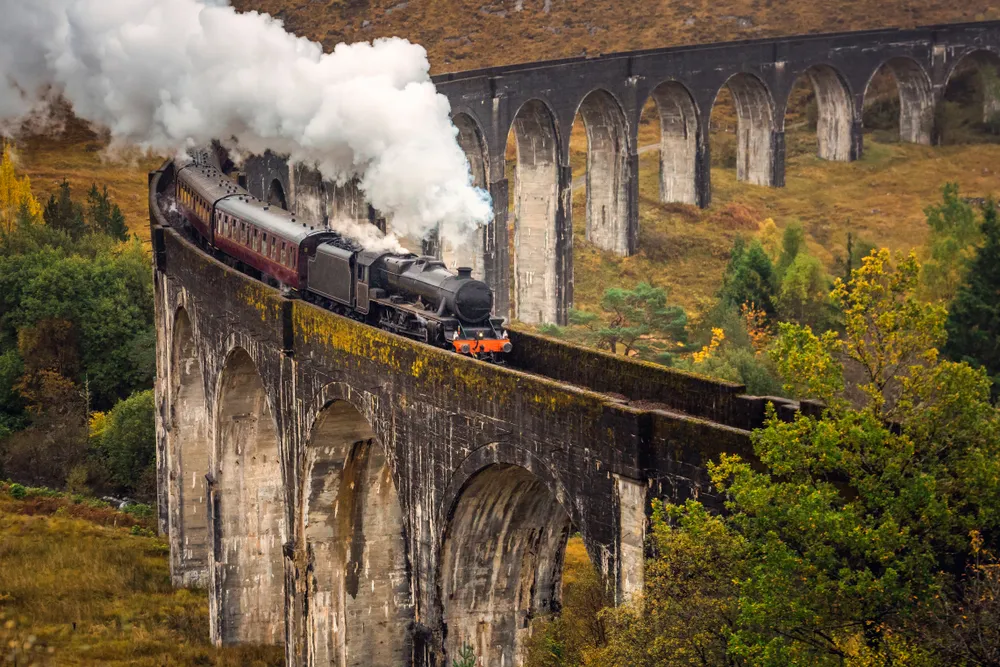 The West Highland Line steam train travelling over the Glenfinnan Viaduct.