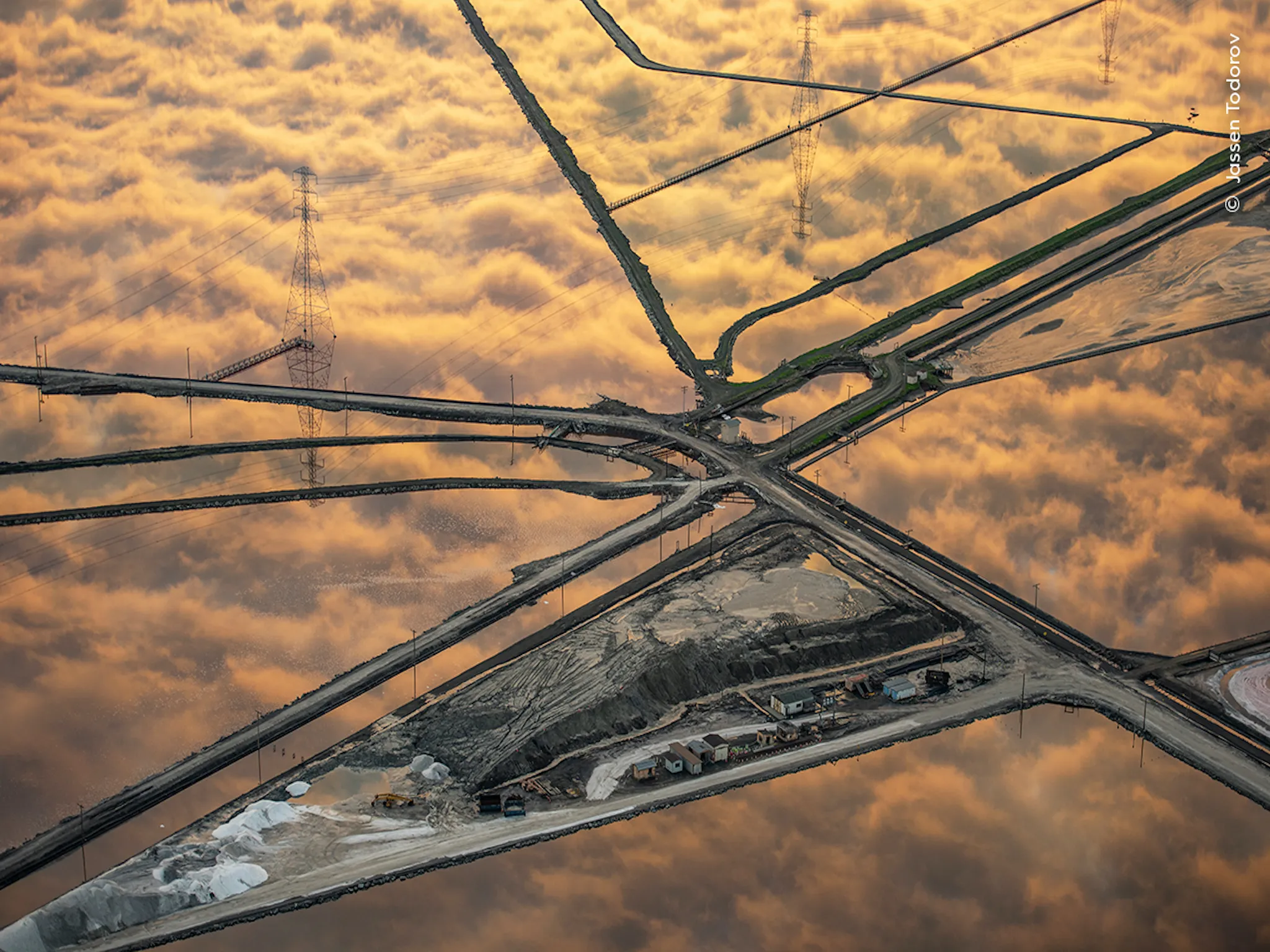 An aerial shot of a town covered by clouds