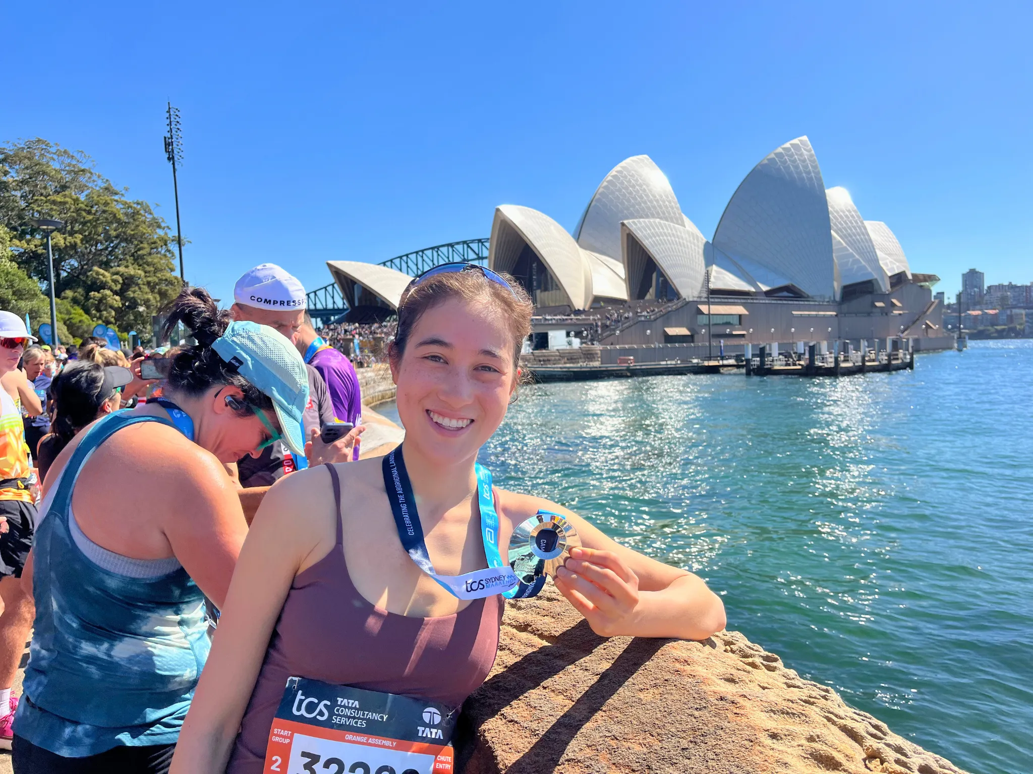 Girl smiling in front of Opera House