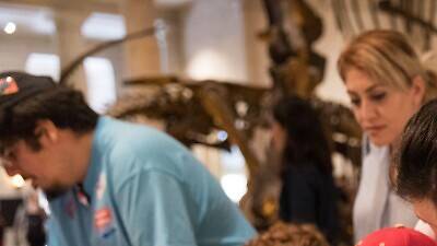 Natural History Museum of Los Angeles County Dino Fest Kids looking at dinosaur fossils.