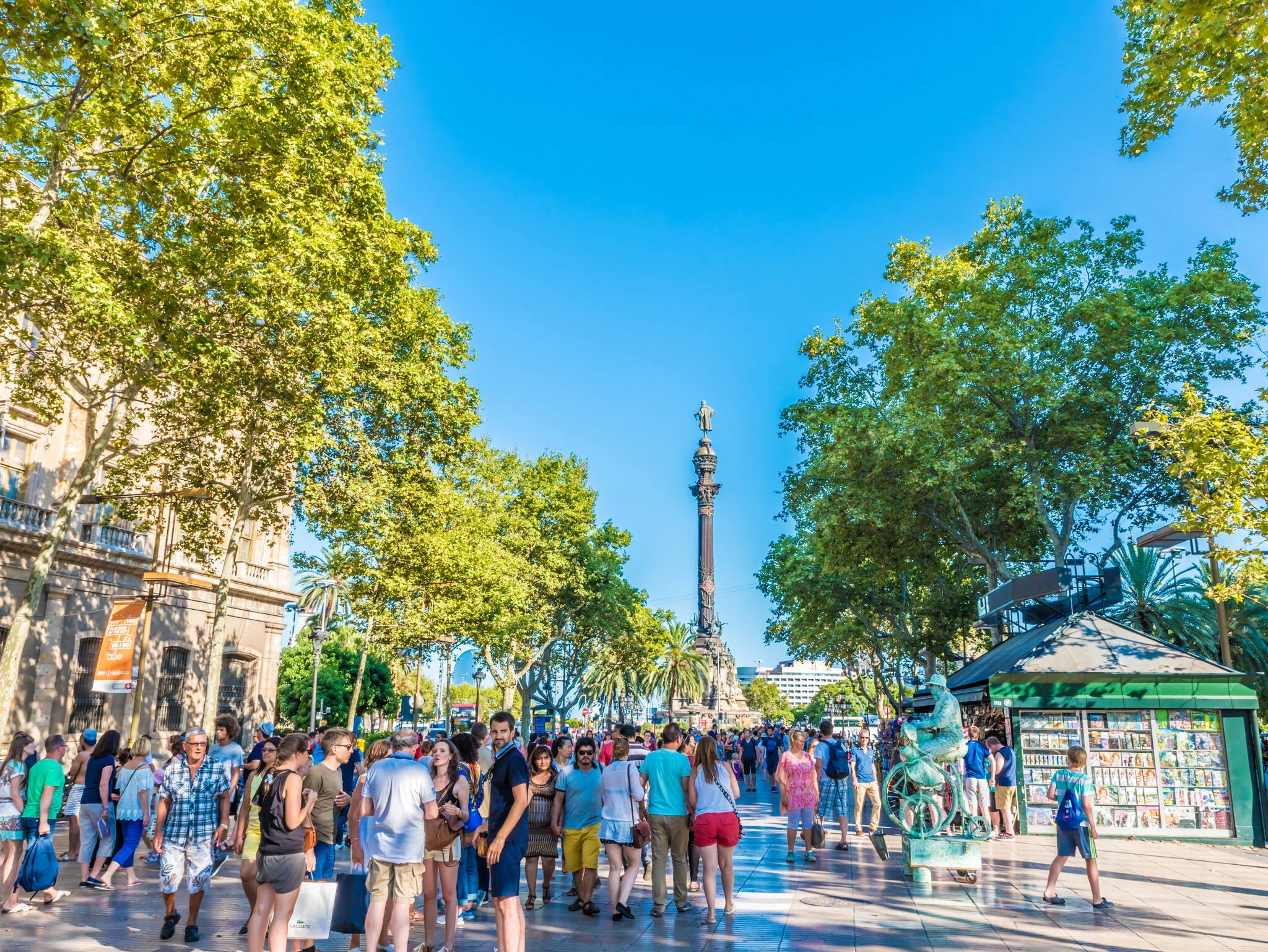 Street view of La Rambla in Barcelona, Spain. Barcelona is the capital city of the autonomous community of Catalonia in the Kingdom of Spain