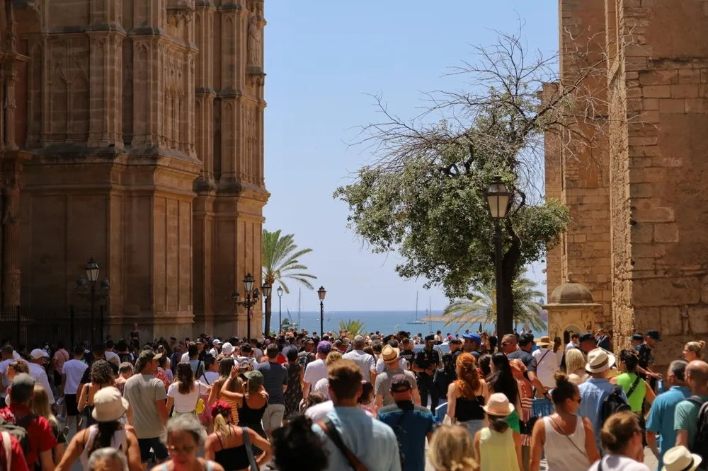 Tourists crowd the streets of Palma de Mallorca, Spain