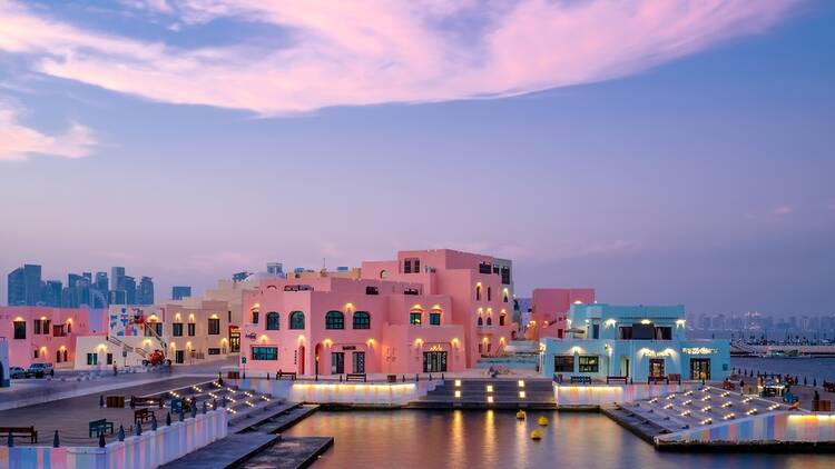 The colourful Mina District in Doha, Qatar with purple sky