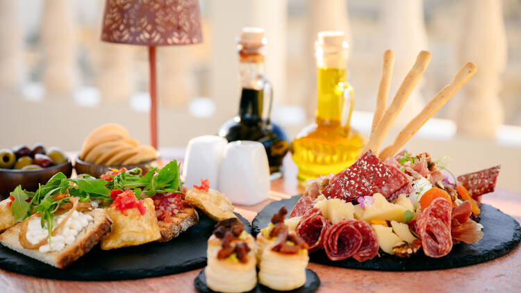 Palazzo Castagna, food being served and olive oils in the background