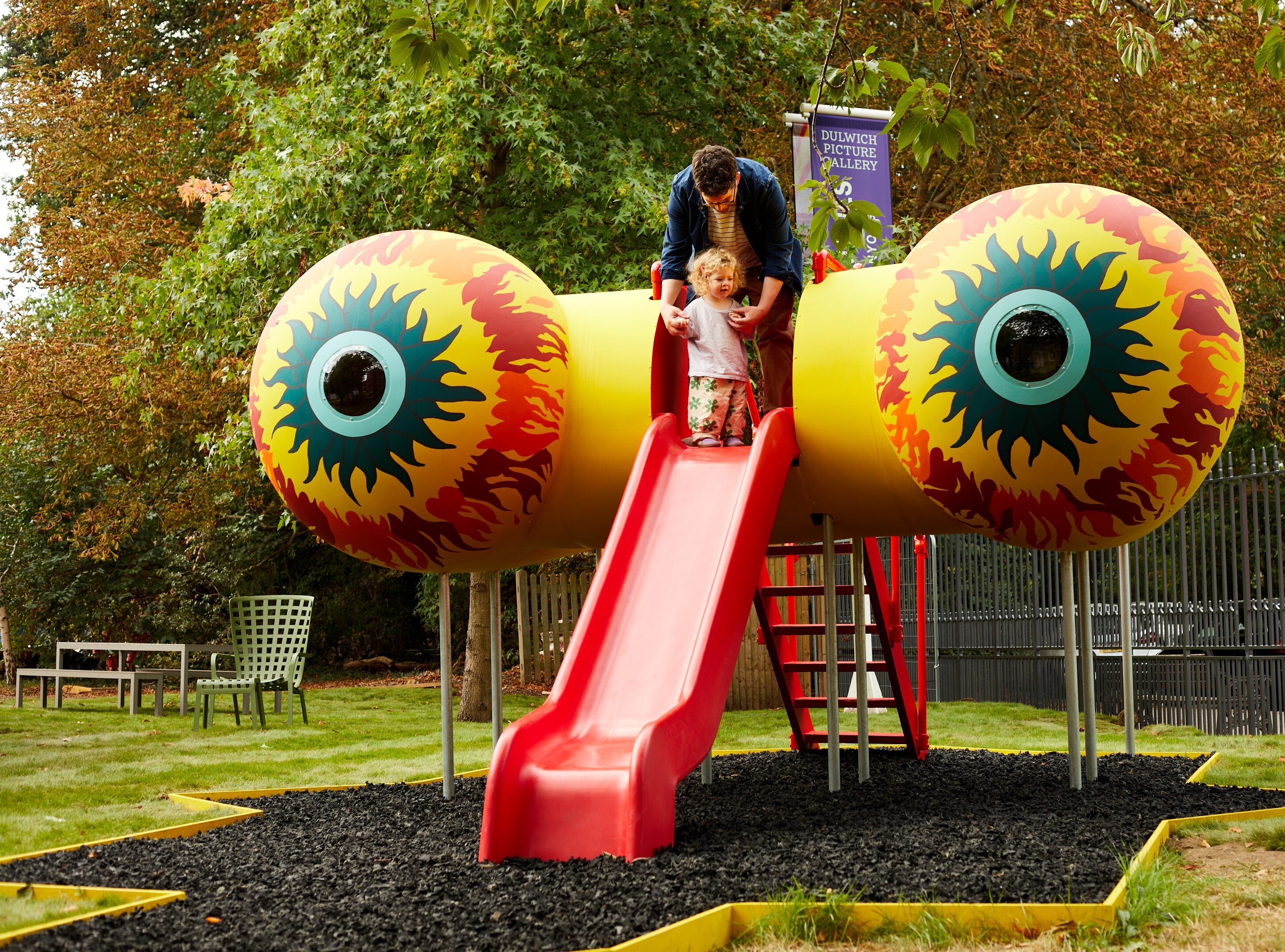 Harold Offeh sculpture slide with glowing red and yellow eyes