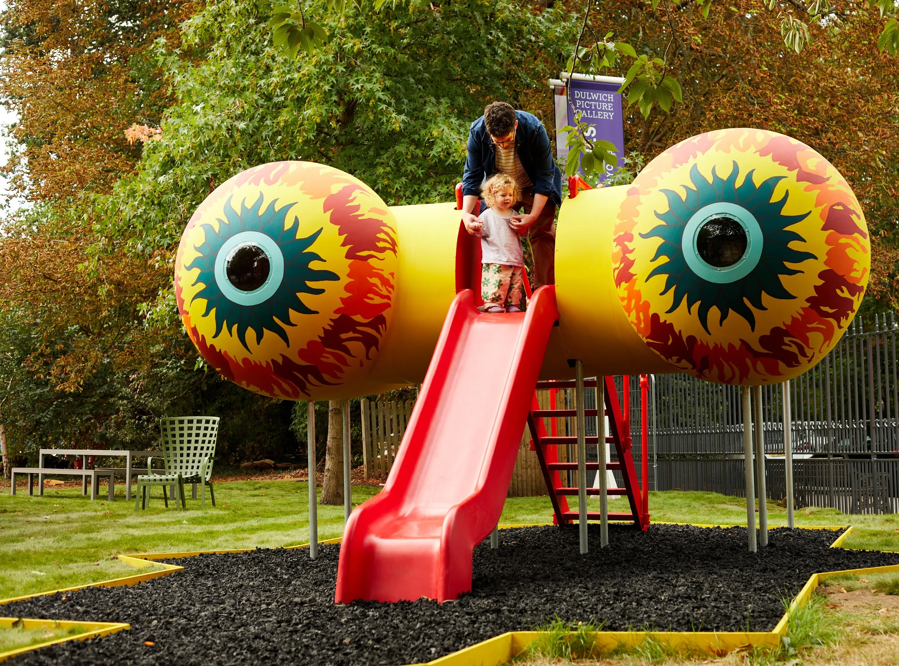 Harold Offeh sculpture slide with glowing red and yellow eyes