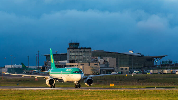 Cork Airport with aeroplane on runway in foreground