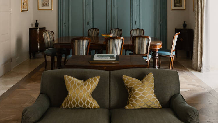 Xara Palace interiors showing a sofa and long table in the background
